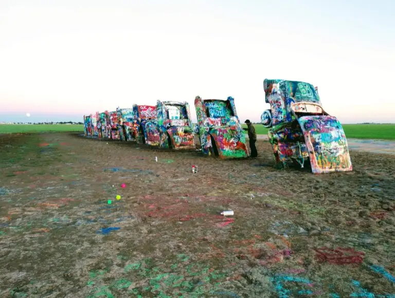 The great Cadillac Ranch 6 heavily graffitied cars buried with the engine down about a third into the ground.