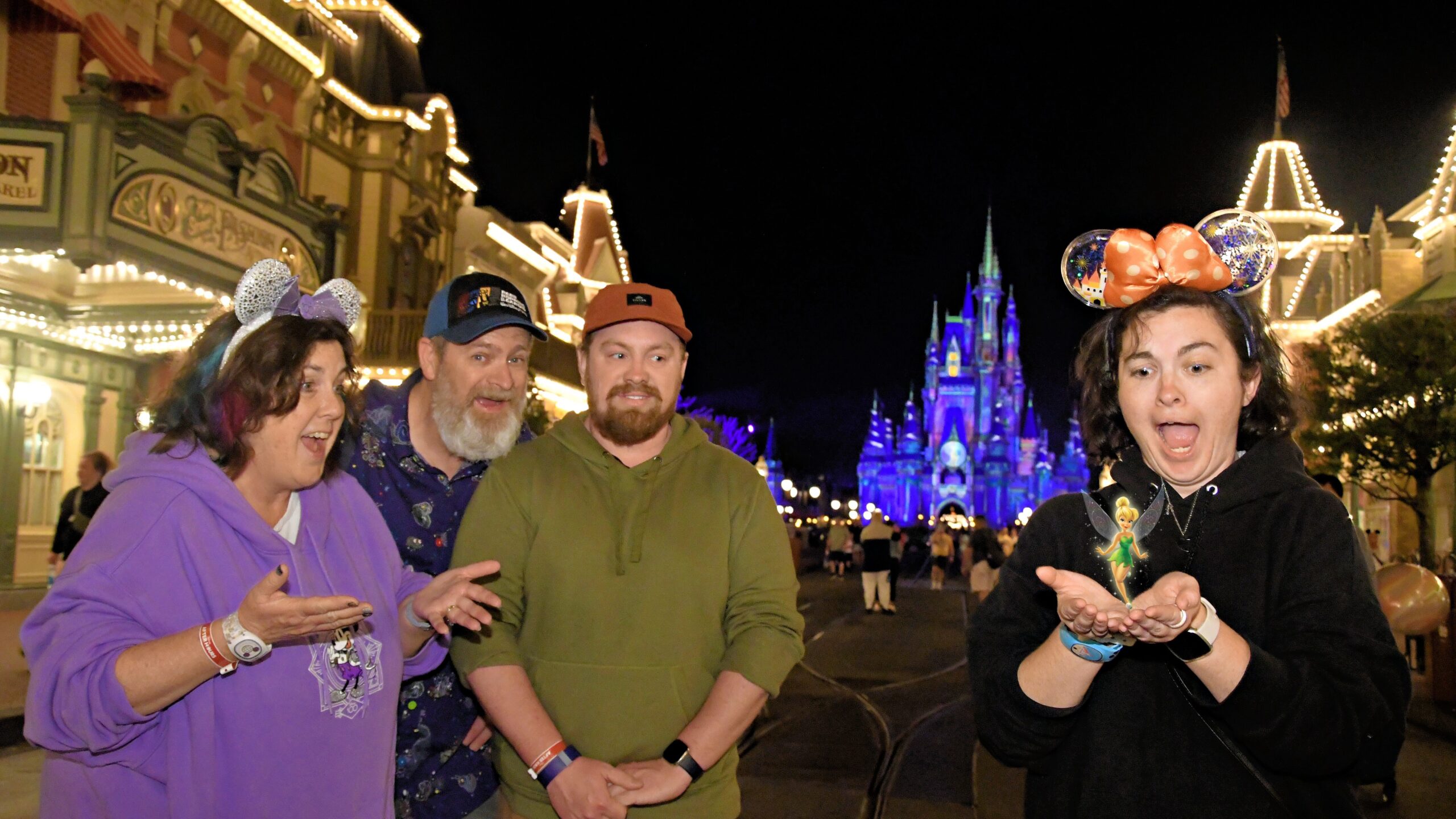 A magical Disney PhotoPass moment on Main Street, U.S.A. as Tinker Bell appears in our hands with Cinderella Castle glowing behind us. A perfect Magic Kingdom memory.