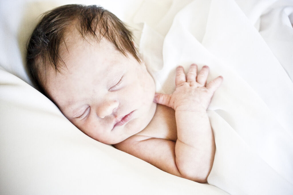 A newborn baby sleeping peacefully, symbolizing trust, vulnerability, and God’s care during a season of uncertainty.